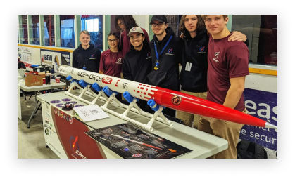 uOttawa Rocketry team posing with a sounding rocket