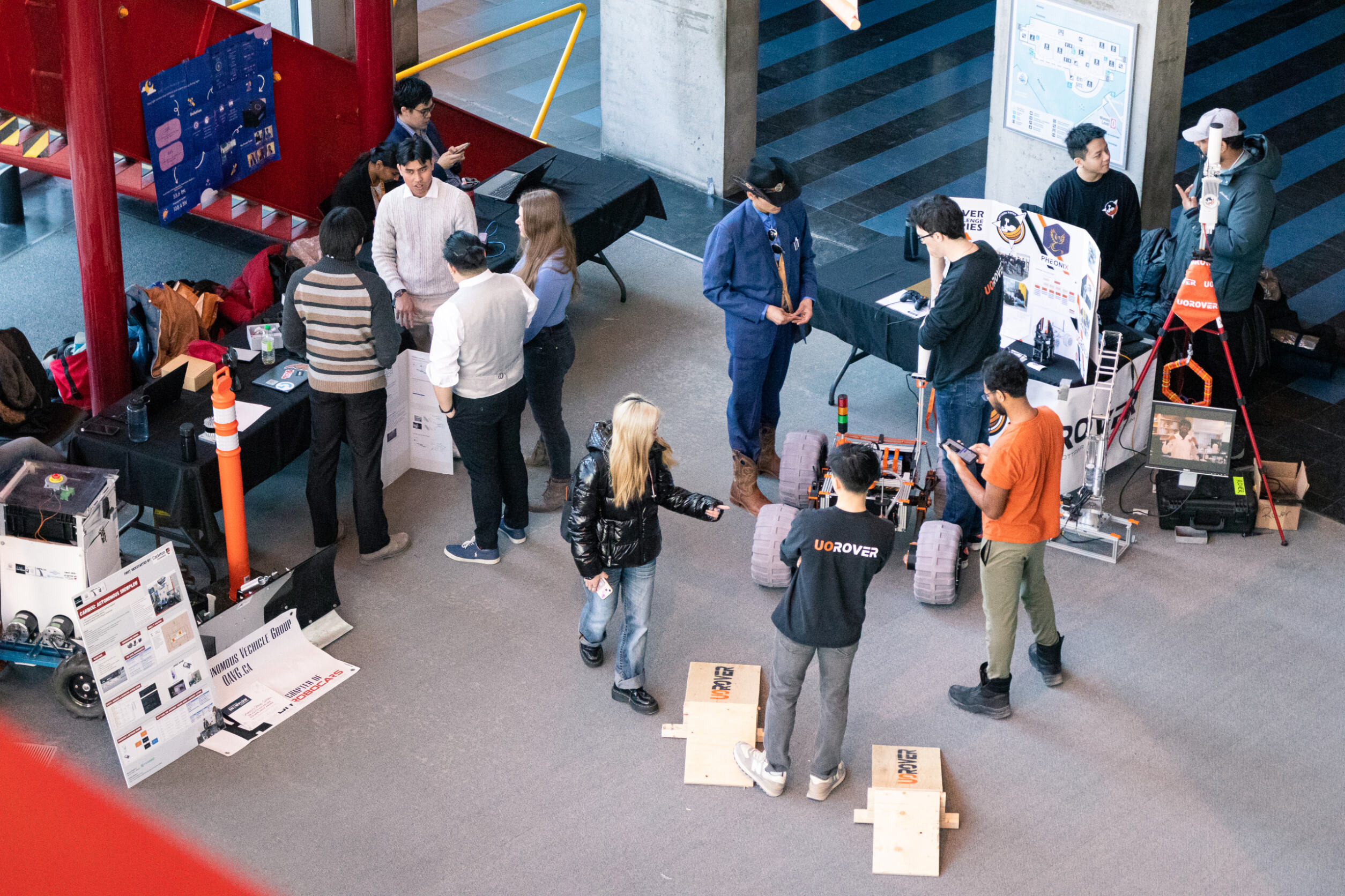 People watching a project demonstration in SITE